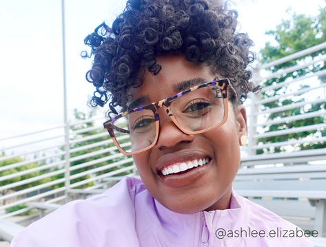 Women wearing colorful reading glasses smiling 