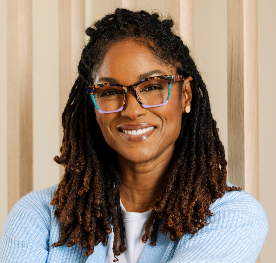 Women wearing colorful reading glasses smiling 