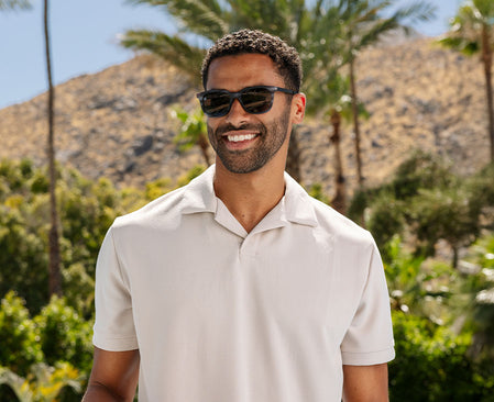 Man in black sunnies outside