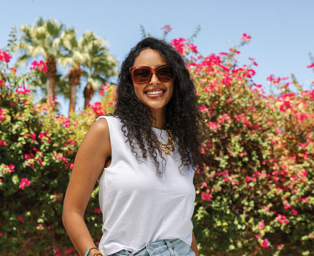 girl in orange sunnies outside