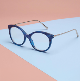 Navy and metal reading glasses on a blue and pink background