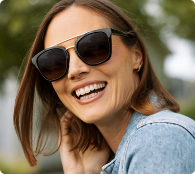 Women wearing polarized sunglasses outside 