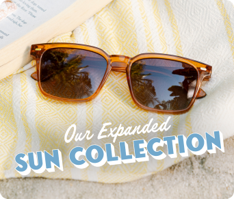 "Our expanded Sun Collection" Orange sunglasses on a yellow towel