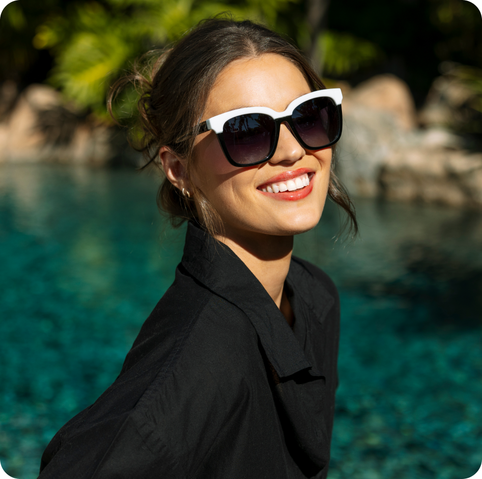 women wearing black and white sunglasses