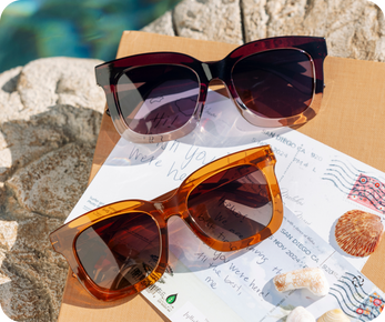 red and orange sunglasses near a pool