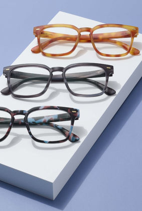 three pairs of reading glasses for men and women