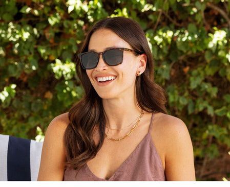 women wearing tortoise sunglasses outside